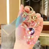Colgante de llavero de conejo de orejas largas iridiscente de cristal transparente acrílico, decoración para coche y bolso, regalo exquisito de alta gama