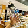 Vaso de vidrio de gran capacidad, resistente al calor y a las caídas, con un infusor incorporado para separar las hojas de té del agua, y una pajilla para beber fácilmente sobre la marcha