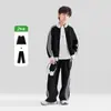 Ropa Infantil Zuoxi Traje Deportivo para Niños 2026 Otoño Nuevo Chaqueta Infantil Patrón de Gofre Bloque de Color Cuello Alto Conjunto para Primavera y Otoño