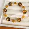 Pulsera de cuentas de vidrio y ojo de tigre, sensación de lujo ligero de nicho de alta gama, estilo vintage, joyería versátil para el uso diario para mujeres