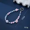 Nuevo colgante de manzana y mariposa con cuentas hecho a mano para teléfono, con un toque de alta gama, charm de cadena doble para bolso, cadena para colgar el teléfono, regalo