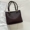 2026 Verano Nueva Moda Retro Personalidad Elegante Casual Texturizado Gran Capacidad Patrón Tejido Bolso de Hombro Único Tote