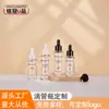 Botellas cuentagotas redondas transparentes personalizadas de 30/50 ml, botellas de plástico de pared gruesa para dispensar sueros cosméticos