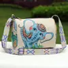 Bolso Almohada Estilo Étnico para Mujer 2026 Nuevo Bolso Cruzado de Correa Ancha Bolso Cubo Doble Cara Bolso Cilíndrico Retro de un Solo Hombro