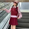 Conjunto Estilo JK Universitario para Niñas Primavera/Otoño 2026 Modelo Nuevo Niños Grandes Chaleco de Punto Camisa Falda Plisada Conjunto de Tres Piezas para Niños