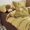 Lujo ligero, simple y suave, juego de cuatro piezas de ropa de cama para el hogar de estilo Muji catiónico con cordón para dormitorio estudiantil - un regreso a la simplicidad