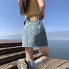 Saia Jeans de Cintura Alta para Mulheres Verão 2025 Novo Estilo Cobrindo a Virilha, Efeito Emagrecedor e Justa nos Quadris Pequena Saia Evasê Anti-Exposição