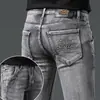 Calça jeans masculina de marca italiana de alta qualidade e tendência, coleção outono e inverno 2026, calça casual slim fit elástica preta e cinza com forro de fleece