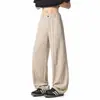 Textura refrescante pantalones rectos color albaricoque claro líneas segmentadas tridimensionales holgados adelgazantes ligeros con caída pantalones hasta el suelo moda masculina