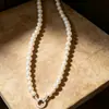 Luz de luxo estilo francês retro design personalizado caixa de cauda fivela redonda pulseira de pérolas pulseira de moda elegante de alta qualidade para mulheres