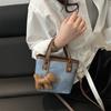 Venta al por mayor transfronteriza de bolsos texturizados de nicho, Nuevos bolsos versátiles de hombro y cruzados para el verano 2026, Bolsos de cubo de moda
