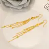 Brincos Banhados a Ouro com um Design de Moda Único Apresentando Estrelas e Notas Musicais, um Acessório Simples Longo para Meninas, com Franjas Douradas para um Visual Estiloso