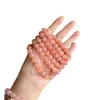 Promocional de Transmisión en Vivo Pulsera de Peluche Flor de Durazno Rosa Fabricante Venta al por Mayor Natural Seda Dorada Jade Flor de Durazno Relleno Pulsera de Cuentas Redondas