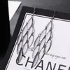 ¡Guau!Moda Transfronteriza Europea y Americana, Varios Pendientes Largos Metálicos de Borla Exagerada de Estilo Moderno con Elementos Elegantes