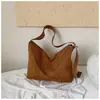 Bolsa de axila con textura de nicho Otoño/Invierno para mujer 2026 Nuevo Bolso cubo de gamuza y felpa Bolso de hombro cruzado simple