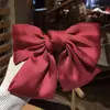 Clip de resorte con lazo de perla, accesorio para el cabello de alta gama, elegante y francés para celebridades de Internet.