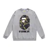 Otoño e invierno estilo japonés marca de moda cabeza de simio estampado de dibujos animados unisex joven suéter sudadera holgada venta al por mayor y dropshipping