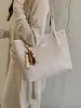 Nova bolsa de ombro feminina de comércio exterior transfronteiriço, bolsa de mão feminina de trama de grande capacidade, bolsa de trabalho versátil, simples e moderna