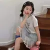 Conjunto de Camiseta de Manga Corta con Estampado de Cachorros Estilo Dulce para Niñas 2026 Nuevo Estilo Verano Niños Grandes Estilo Coreano Falda a Cuadros Conjunto de Dos Piezas