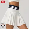 Nueva falda plisada de tenis de cintura alta para otoño e invierno para mujer, minifalda deportiva de bádminton con bolsillos, falda falsa de dos piezas anti-exposición