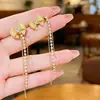 Pendientes Colgantes Largos de Cuadros Estilo Coreano Lujo Ligero Llevado de Dos Maneras Tendencia INS Lujo Ligero Nicho Pendientes con Borla de Pedrería