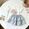 Nuevo conjunto de verano para niñas estilo coreano, elegante y versátil, de manga corta con dibujos animados, dulce y lindo conjunto de dos piezas a cuadros estilo coreano, moderno