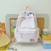 Mochila al por mayor estilo coreano estilo universitario versátil para ir al trabajo y a la escuela para mujer alta apariencia gran capacidad mochila casual escolar