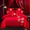 Juego de ropa de cama de lujo estilo chino, hecho de algodón 100% de fibra larga, un juego de cuatro piezas que incluye una sábana y una funda de edredón de algodón puro rojo, perfecto para la alcoba de una recién casada.
