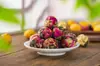 Té aromático de bola de dragón Pu'er hecho a mano de Yunnan transfronterizo té de bola de dragón de jazmín venta al por mayor té aromático de bola de dragón flor de rosa y peonía