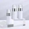 Botella secundaria de loción de 40 ml, plástico PET, botella para el cuidado de la piel de loción, tipo dispensador, cilíndrica, hombro plano, botella de empaque color blanco lechoso