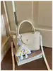 Bolso de mano tejido de nicho de alta gama estilo coreano para mujer, nueva moda 2026, versátil para el trabajo, de hombro y cruzado