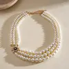 Collar de perlas en capas con cuentas transfronterizo europeo y americano, cadena para la clavícula estilo fiesta vintage, lujo ligero, accesorio versátil de alta gama para mujer