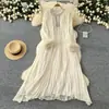 Vestido Elegante de Cor Sólida Outono 2024 Novo Cruzamento Europeu e Americano Gola Redonda Diamante Solto Costura de Pelúcia Vestido Plissado