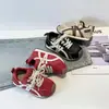Tênis Infantil Forrest Gump Modelos Primavera e Outono Tênis Esportivo Masculino 2025 Respirável Solado Macio Tênis Casual Feminino Treinamento Alemão Retrô Versátil