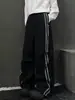 Pantalones cargo plisados casuales con cremallera lateral 2026 para hombres y mujeres otoño rectos holgados versátiles modernos pantalones hasta el suelo