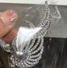 Nuevo broche de rosa de aleación de diamantes europeo y americano, diseño de personalidad elegante de alta gama, pin de planta, ramillete al por mayor