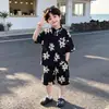 Conjunto de Camisa Floral de Verano para Niños Modelo 2026 Estilo Vacacional Infantil Delgado Seda de Hielo Mangas Cortas Pantalones Cortos Conjunto de Dos Piezas