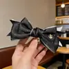Pinza Plátano Plisada Vertical con Lazo Floral para Cola de Caballo de Verano 2026 Nuevos Pasadores para la Parte Posterior de la Cabeza Accesorios para el Cabello