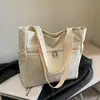 Bolso de lona simple de moda estilo coreano de gran capacidad para mujer, nuevo y elegante bolso de hombro para el trabajo y para salir, invierno 2025