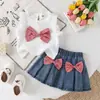 Conjunto de Niña de Comercio Exterior Chaleco para Descanso con Lazo + Falda Plisada de Mezclilla Retro Estilo Escolar Temperamento Dulce En Stock