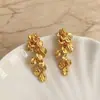 Pendientes de borla de hoja de oro de lujo ligero para mujer, pendientes versátiles de nicho vintage con un diseño de alta gama, pendientes de aguja de plata S925
