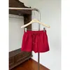 Falda casual de ajuste holgado con cintura elástica para mujer, nuevo estilo de verano, falda corta versátil de línea A con cordón anti-exposición