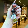 Llavero colgante de Kuromi brillante transfronterizo, adorno de arena líquida, decoración de escritorio Sanrio de moda al por mayor