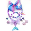 Conjunto de collar y pulsera con lazo de cola de sirena para niña, aretes de concha y clip, anillo de escamas de pez y princesa