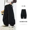 Calça Cargo Lavada Estilo Coreano Retrô com Fenda e Corte Curvo para Meninos Primavera e Outono 2026 Nova Calça Solta Street Dance Infantil Tendência