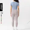 Conjunto de roupa de yoga europeu e americano transfronteiriço para mulheres, justo, secagem rápida, roupa esportiva para atividades ao ar livre, conjunto de duas peças com short de manga curta e calça longa para fitness