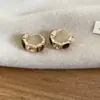 Pendientes de Flor de Ojo de Tigre Color Café Transfronterizos Europeos y Americanos, Aretes de Moda y Únicos, Pendientes de Lujo Ligero y de Alta Gama al por Mayor