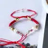 Pulsera de cuerda tejida a mano ajustable para hombres y mujeres este año pulsera de cuerda roja para parejas venta al por mayor