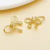 Chapado en cobre de 18k con oro real, huecos, con dijes perforados de mariposa y corazón, adecuados para pendientes, collares y otros accesorios de joyería DIY