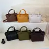Bolso de mano moderno y sencillo, bolso tipo cubo texturizado, nuevo de la versión coreana para el verano de 2026, bolso de hombro simple y elegante, bolso cruzado